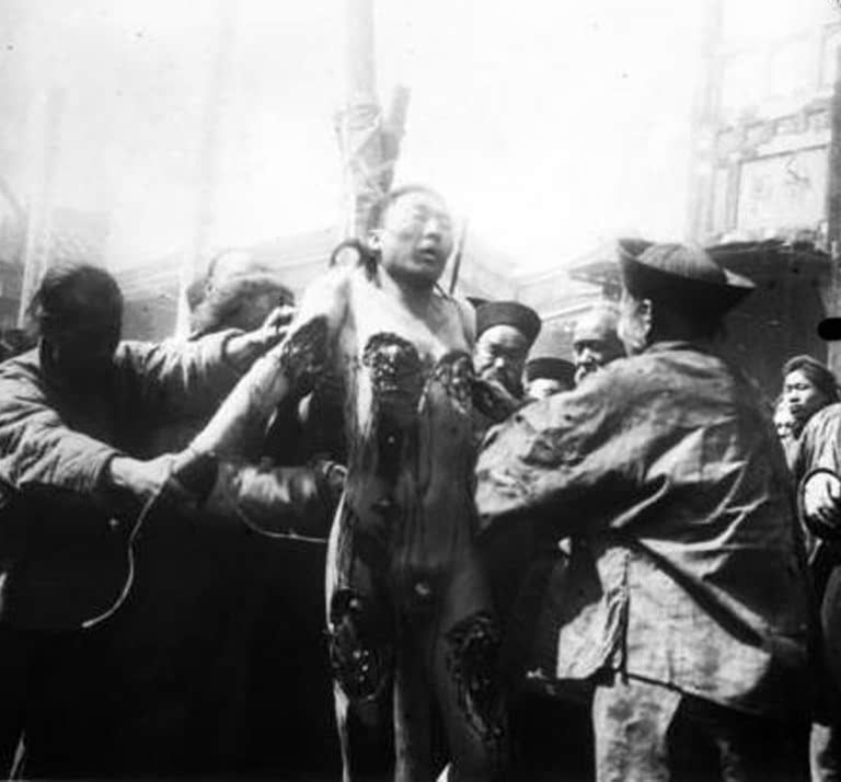 China: An execution by the 'Death of a Thousand Cuts' (1884).